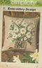 A PILLOW COVER OF EMBROIDERED DAISIES